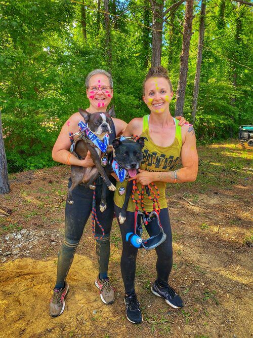 2 women with their dogs at the Canine Biathlon